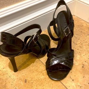 Black leather heel with ankle strap.